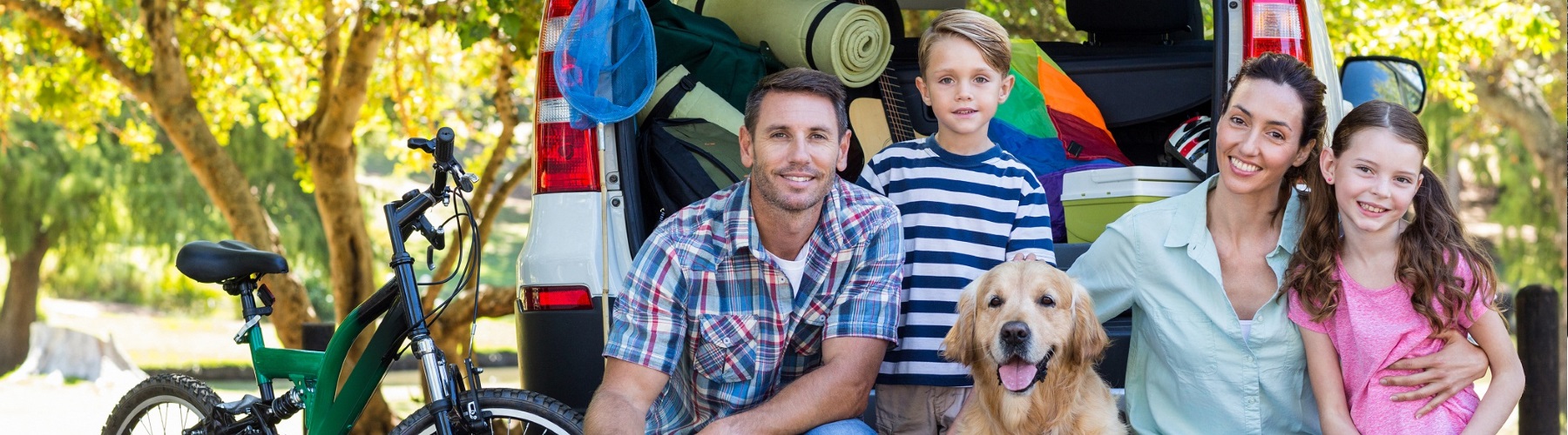 two people fitting four large puzzle pieces together